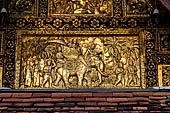 Wat Xieng Thong temple in Luang Prabang, Laos. the Ho Tai, the library. Decoration of the pediment. 